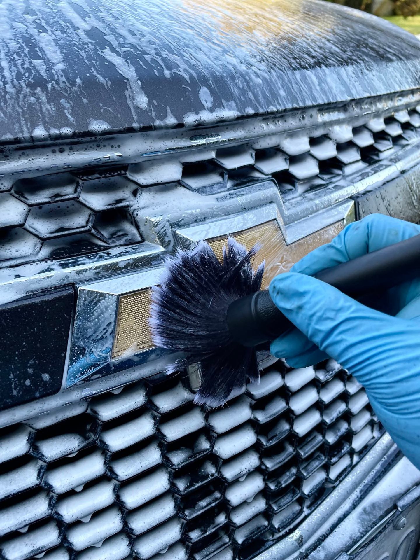 Foam wash & grille detail on a Chevy